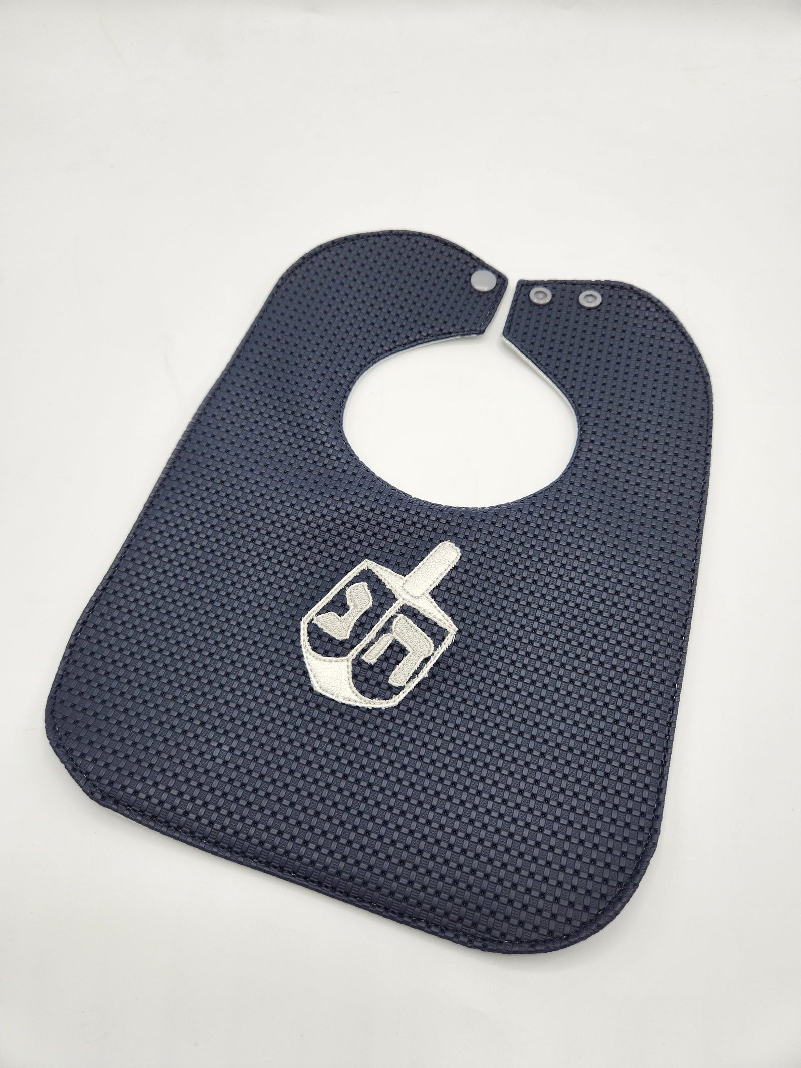 Navy basket weave dreidal bib